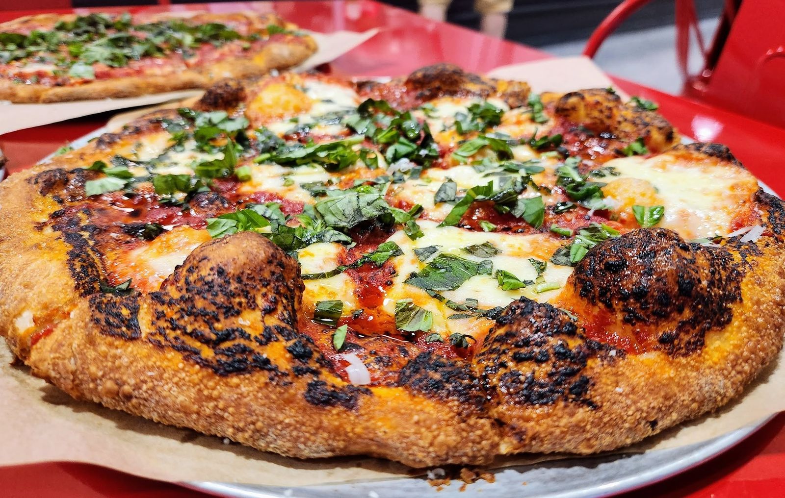 Hands holding a CRUST slice